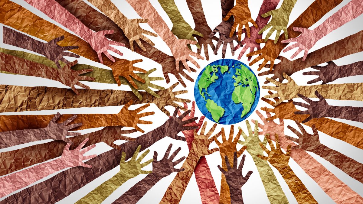 Illustration of multicultural hands reaching toward globe