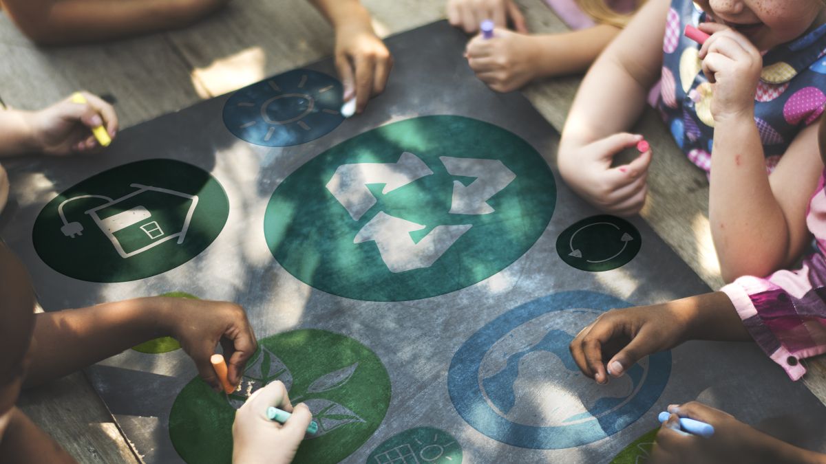 children coloring with chalk